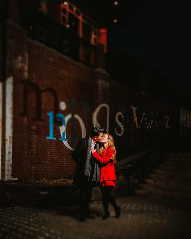 A couple kisses by the staircase in West Hartford's Blue Back Square.