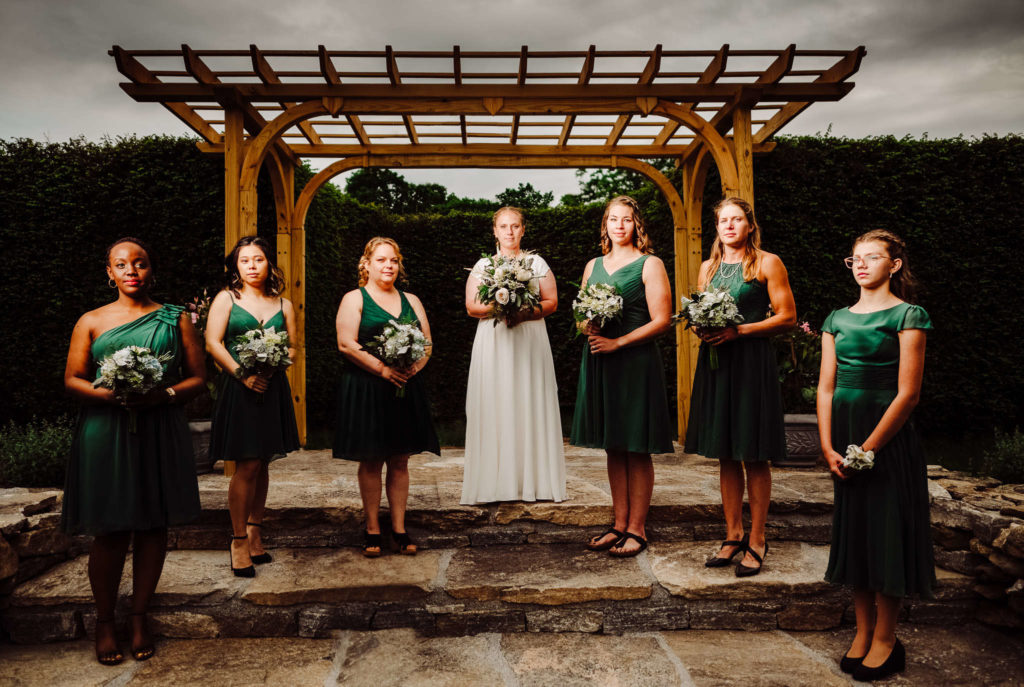 The bride and bridesmaids pose during her Salem Herbfarm wedding.