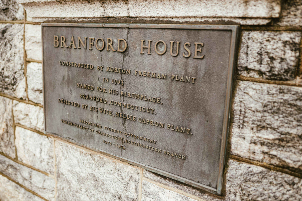 A brass plaque explaining the history of Branford House in Groton Connecticut.