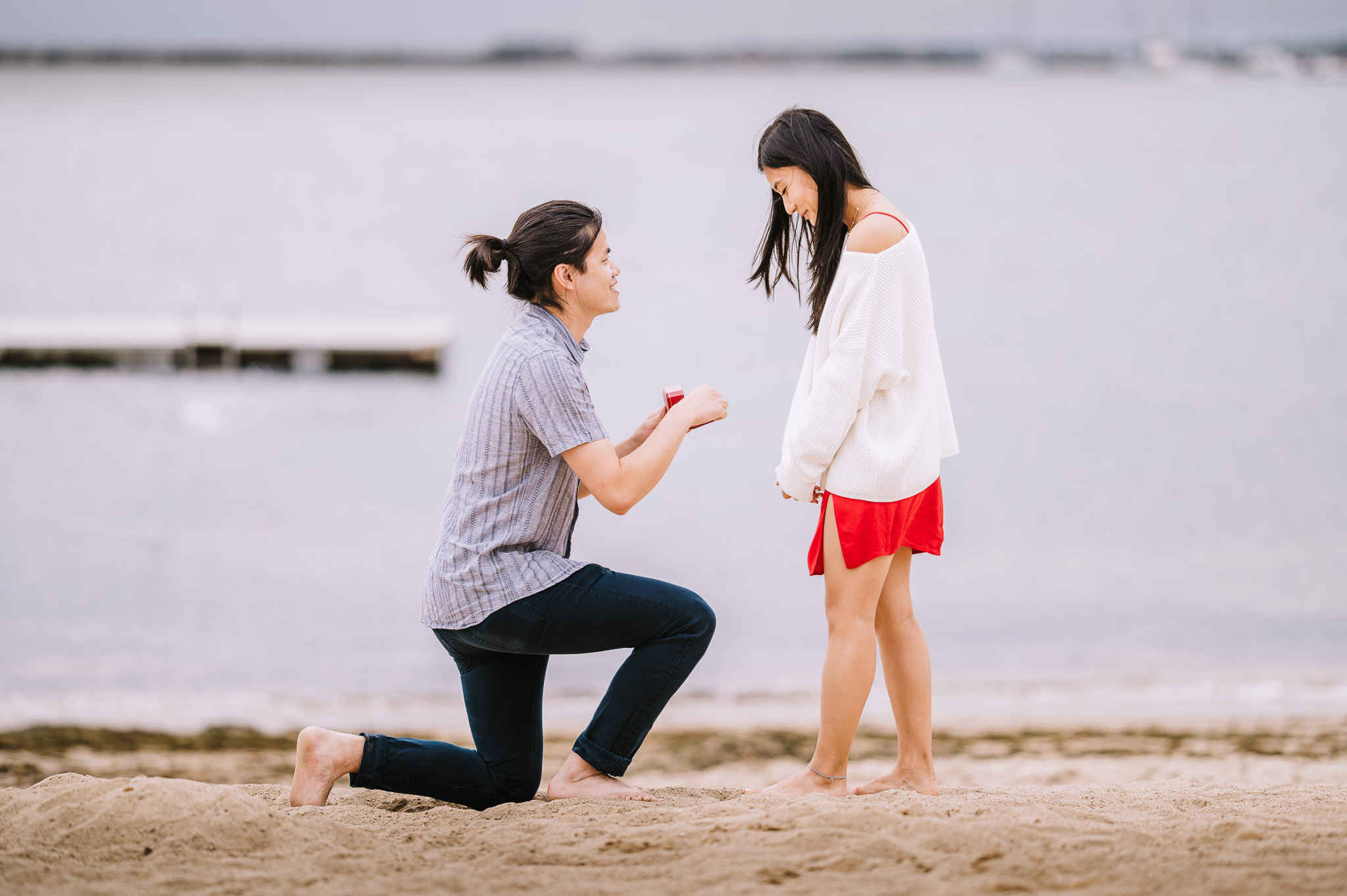 A man proposes to his partner on one knee in Stonington, Connecticut