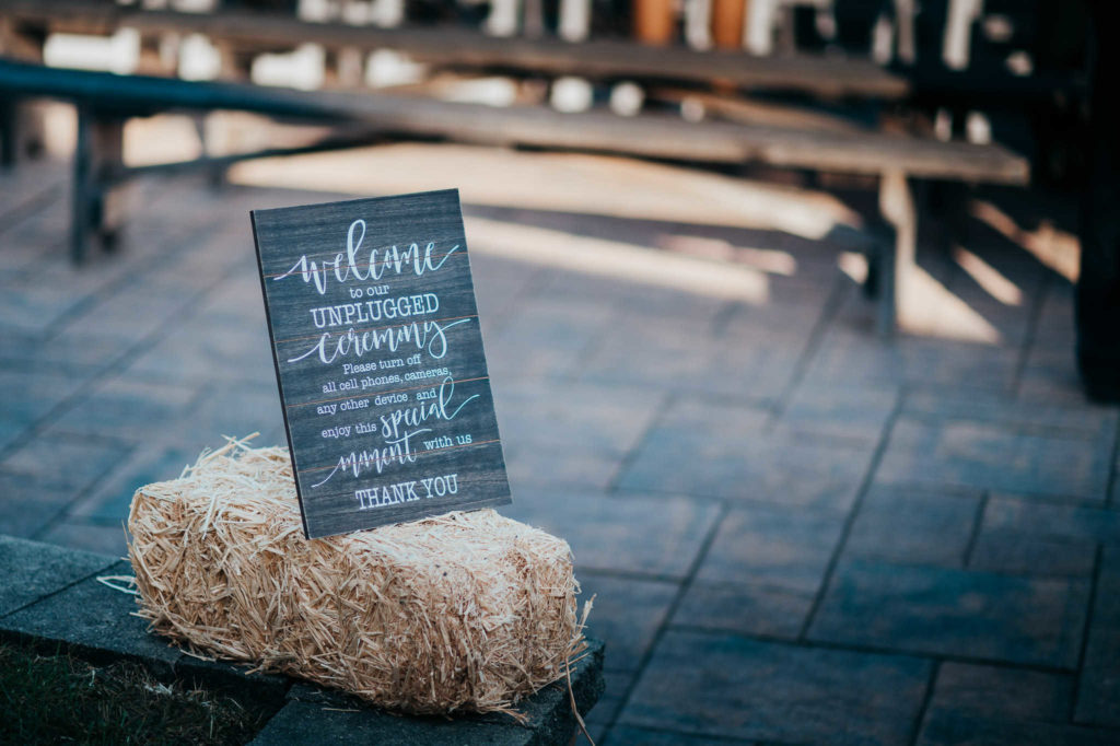 A sign welcomes guests at The Overlook at Geer Tree Farm wedding.