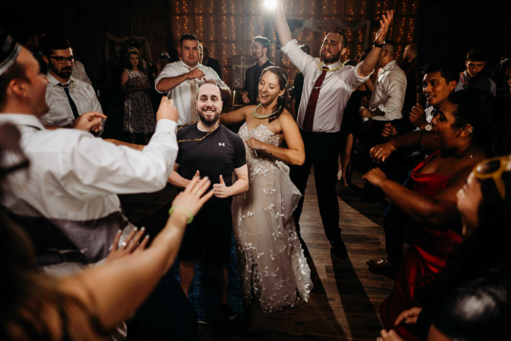 Bride and groom dance with guests during their South Windsor wedding.