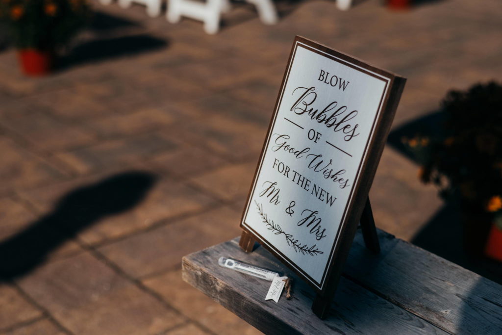 A sign set up by a Connecticut wedding planner welcomes guests to a couple's ceremony.