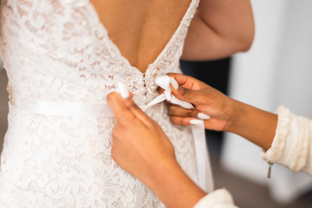 A bride-to-be tries on a dress in Connecticut bridal dress shop Bridal Affection.