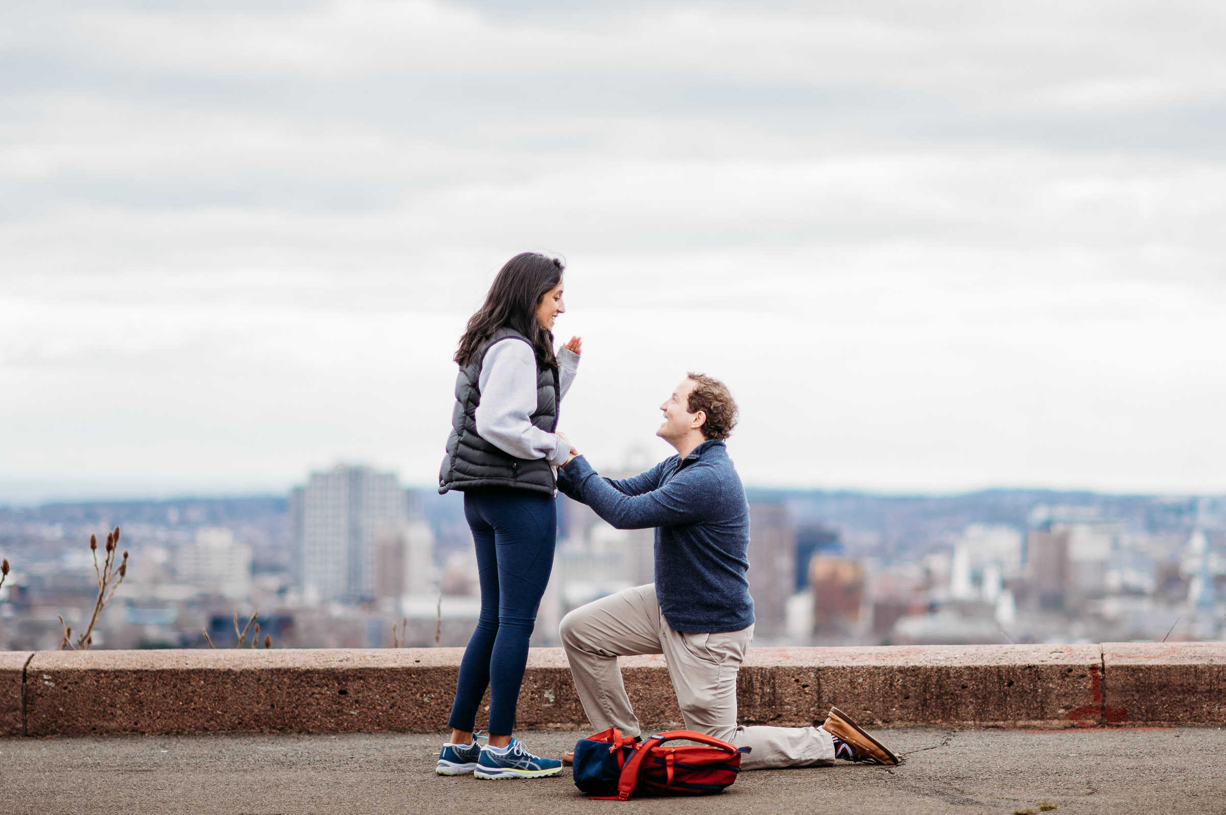 Survivor contestant Daniel Strunk proposes in New Haven before his East Rock engagement session, captured by wedding photographer Terrence Irving.