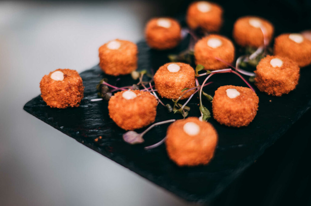 Seafood croquets are served during a Newport Vineyards wedding.
