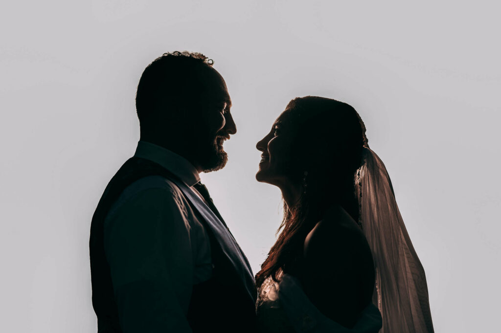 A silhouette of a bride and groom during their Essex CT wedding.