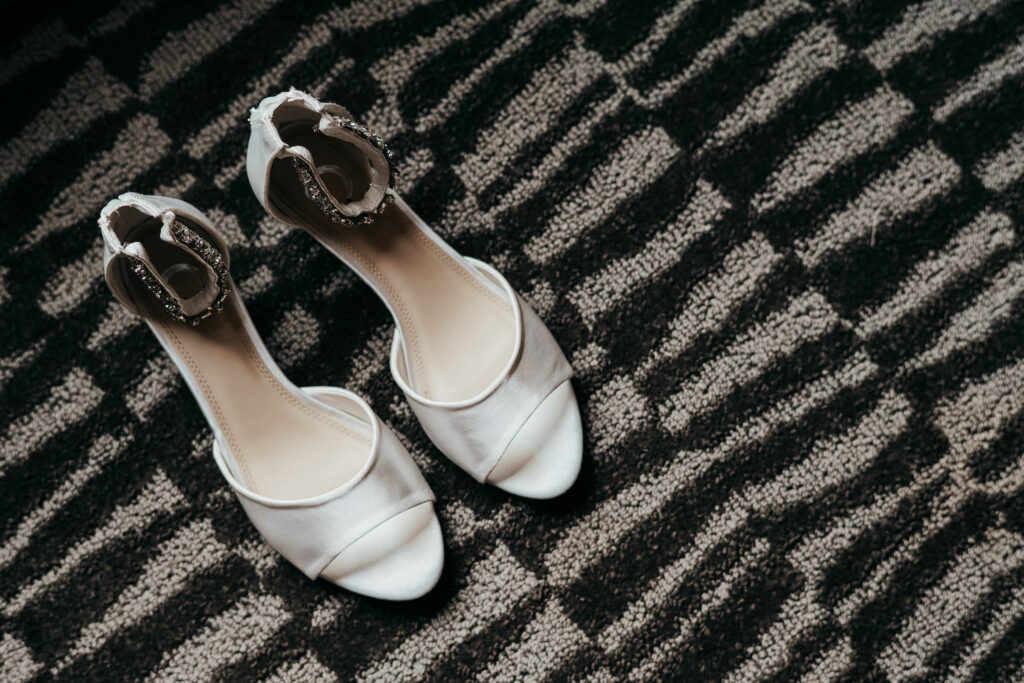 A bride's shoes sit ready to be worn before her fall wedding at Webb barn.