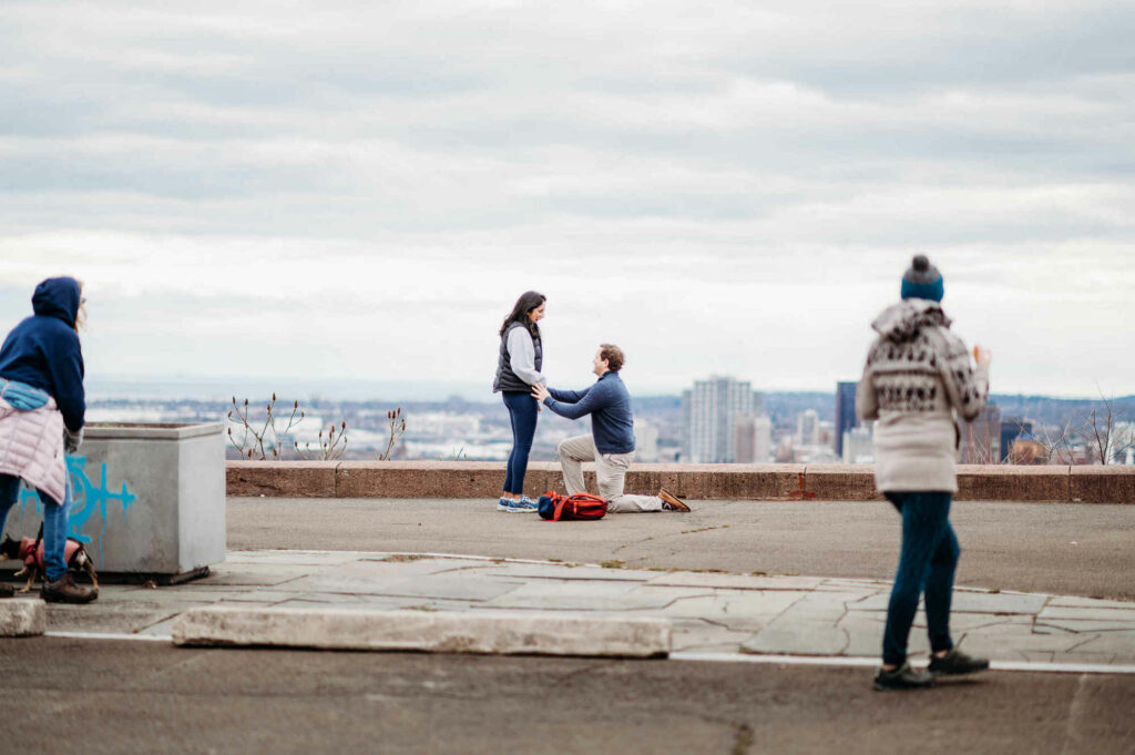 A surprise marriage proposal takes place at the summit of East Rock Park.