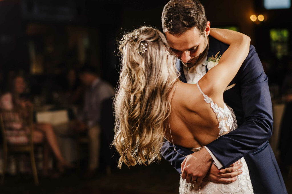 A bride and groom dance in front of their guests during their St. Clements Castle wedding reception.