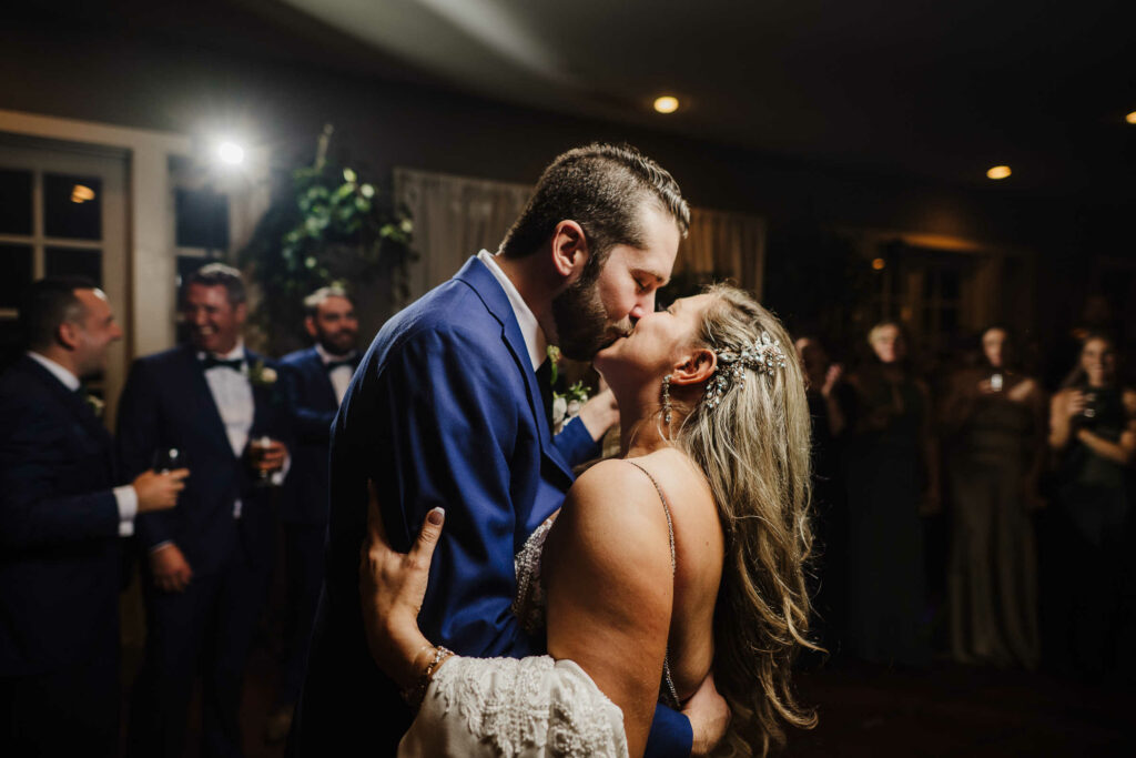 A bride and groom kiss on the dance floor during their Thompson CT wedding.