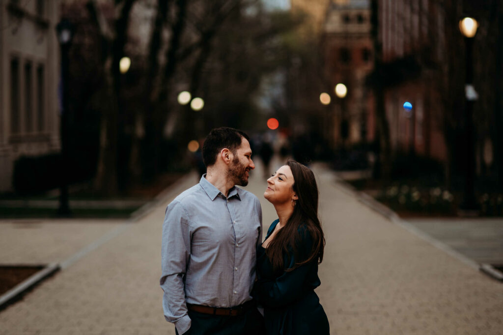 A couple poses for their engagement photos at Yale.