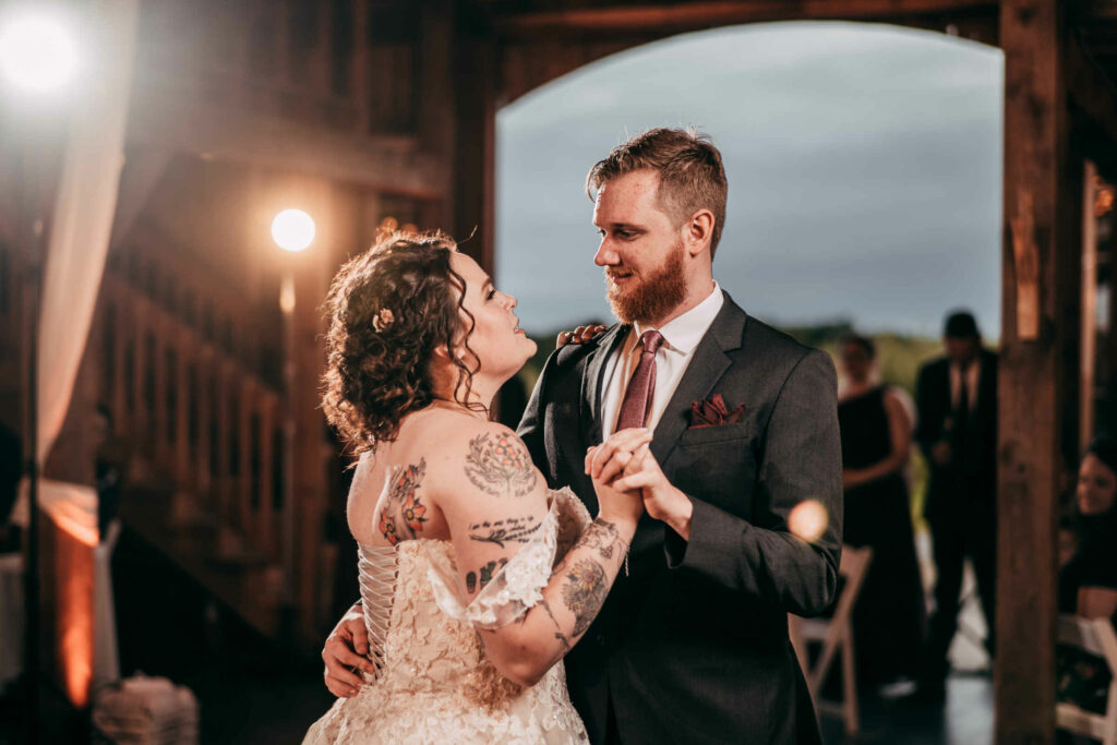 A bride and groom enjoy their first dance during their wedding at The Barn at Allen Hill Farm.