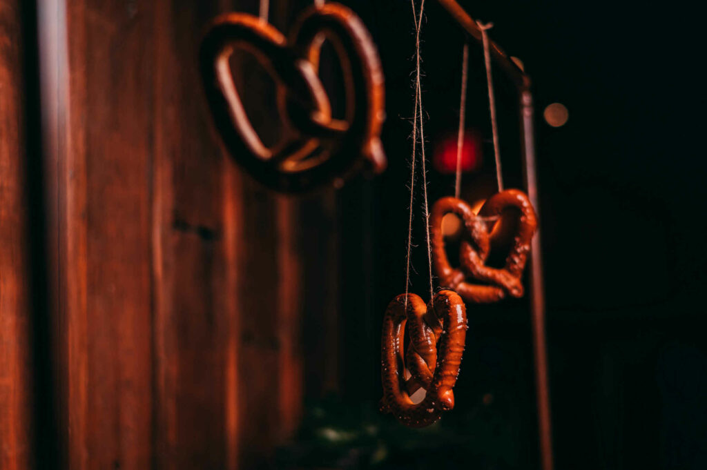 Pretzels dangle from twine during a Barns at Wesleyan Hills wedding.