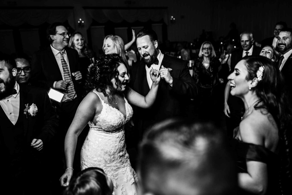 A bride and groom dance together during their wedding at Cascade Hamden.