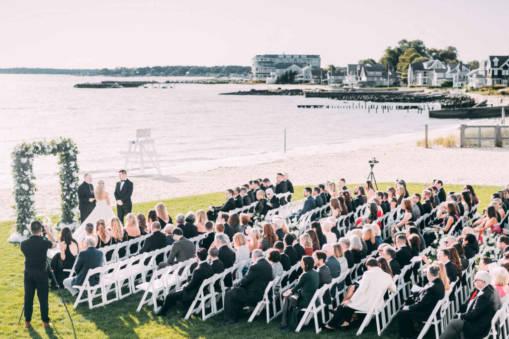 A strong country club wedding venue in Connecticut is Madison Beach Club, where a beachfront ceremony is pictured.