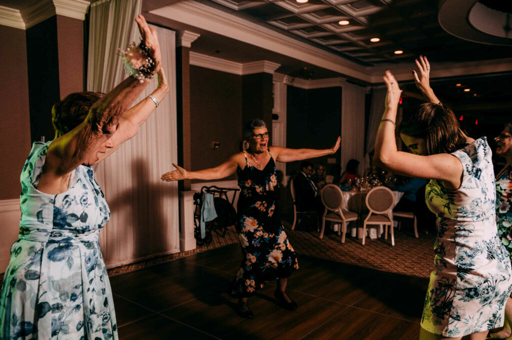 Wedding guests dance at the Simsbury Inn, one of the more classic wedding venues in Connecticut.