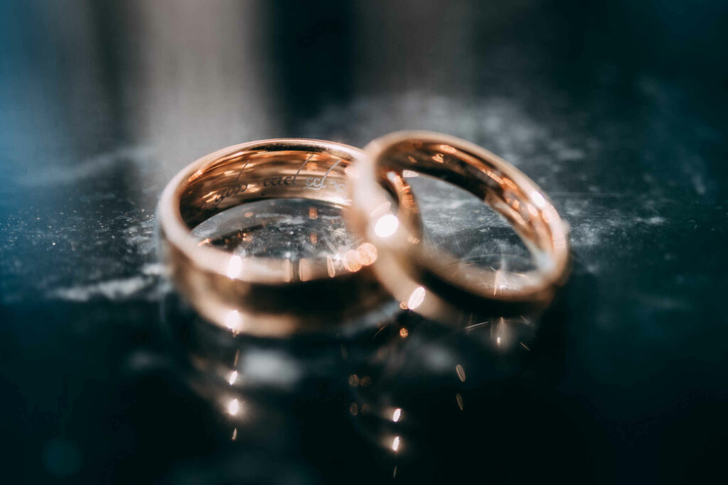 Custom wedding bands with a Lord of the Rings theme are pictured.