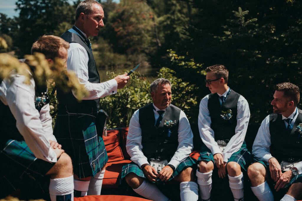 A groom and his groomsmen relax before his wedding in Elizabeth Park.