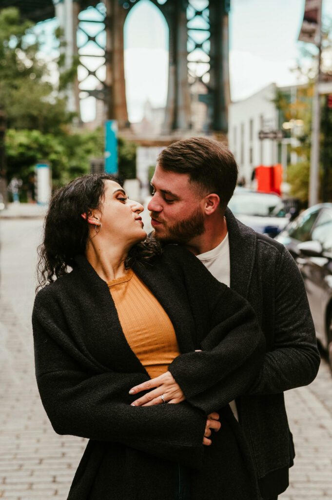 A couple kisses during their Brooklyn engagement session.