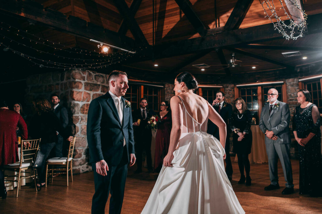 The bride and groom get ready for their first dance during their Towers Rhode Island wedding.