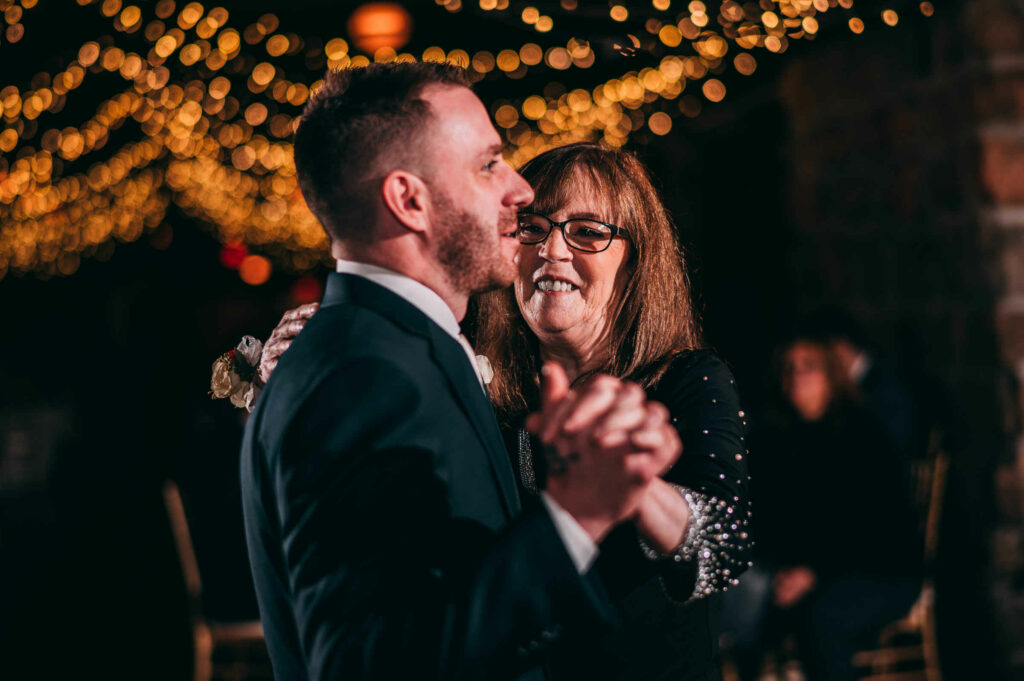 The groom and his mother enjoy a dance during his Towers Rhode Island wedding.