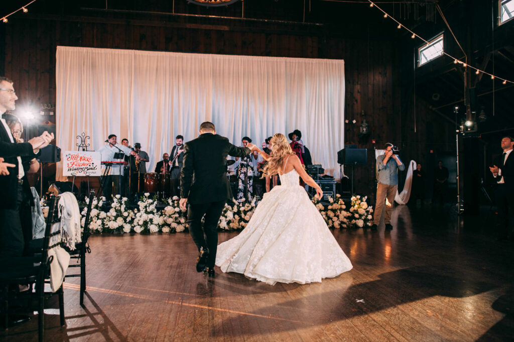 A bride and groom dance together during their Madison Beach Club wedding reception.