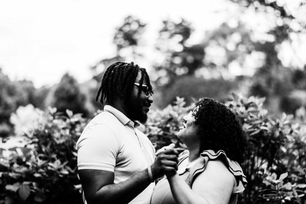 A black couple slow dances together in Cranbury Park, home of Gallaher Mansion weddings.
